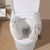 Cat-themed, plush, thickened universal toilet seat cover.